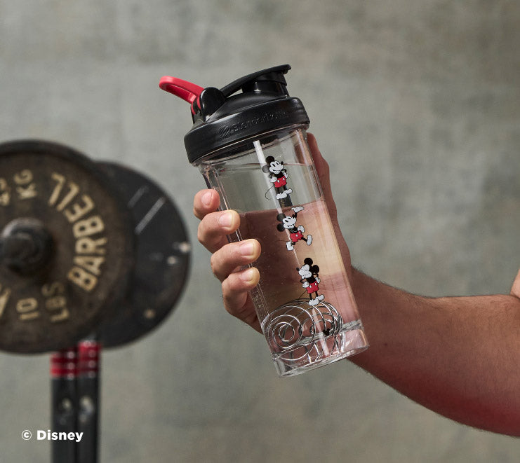 pro-series-o5 Mickey_Mouse_Protein_Shaker_Bottle_Being_Held_In_the_Gym.jpg